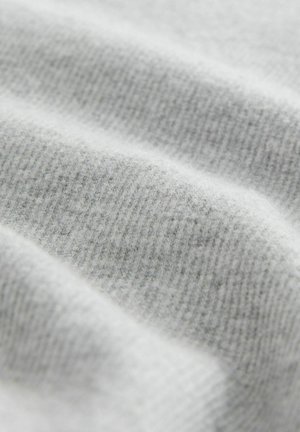 Light gray fabric with a soft, textured ribbed pattern, featuring subtle variations in shading and a smooth, inviting surface.