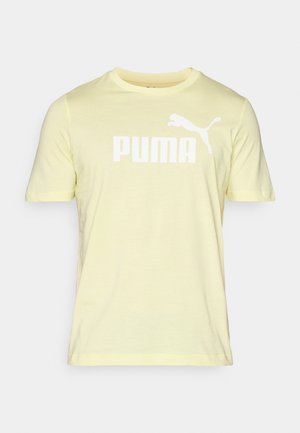 Sárga pamut póló rövid ujjakkal, elöl nagy fehér "PUMA" logóval és puma sziluettel. Puha tapintású, kerek nyakú.
