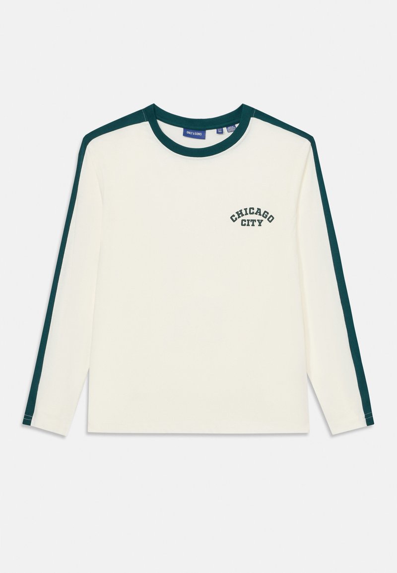 Langermet T-skjorte i kremfarge med mørkegrønne aksenter på ermene og kragen; har "CHICAGO CITY" trykket på forsiden. Myk stoff.