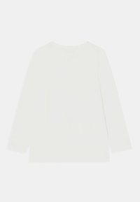 Blusa de manga longa em creme claro, feita de um tecido suave. Apresenta um decote redondo e um acabamento rendado nas mangas e na barra.