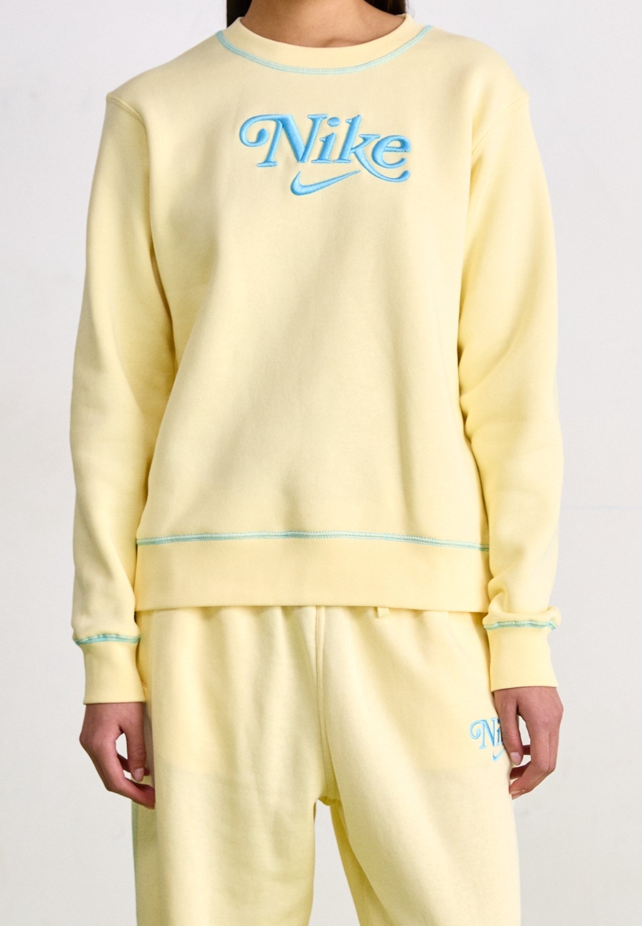 pastel yellow nike crewneck