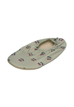 Soft fabric slipper with elastic opening, beige color, printed with small red cherries and green leaves pattern.