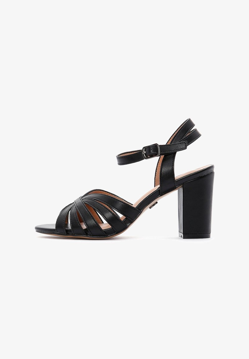 Black high-heeled sandal with an open toe, featuring horizontal straps, ankle strap with buckle, and a chunky block heel.