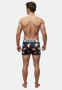 Mörkblå kalsonger för herrar med en tajt passform, prydda med ett tryckt mönster av korv. Mjuk tyg och elastisk midjeband med djärv skrift.