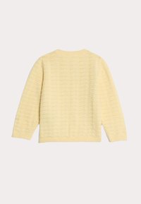 Maglione giallo a maglia con motivo a onde, polsini e orlo a coste, colletto tondo e maniche lunghe.