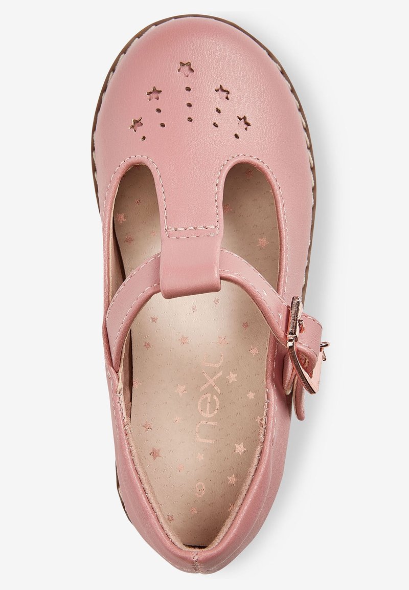 Chaussure Mary Jane en cuir rose pour fille avec perforations en forme d’étoile sur la pointe, bride à boucle et semelle intérieure à motif étoile.