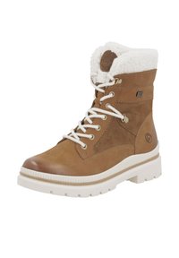 Botas de cuero marrón con cordones y suela de goma blanca texturizada, con un cuello forrado de pelo y ojetes metálicos para los cordones. Logo en el lateral.