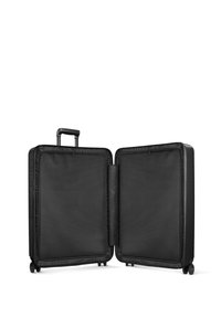 Black hard-shell suitcase with a telescopic handle and four wheels. Interior features a nylon lining and dual compartments for organized packing.