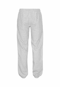 Grå joggingbukser lavet af blødt bomuldsblandet stof med elastisk taljebånd, løs pasform og tilspidsede ankler for komfort og bevægelsesfrihed.