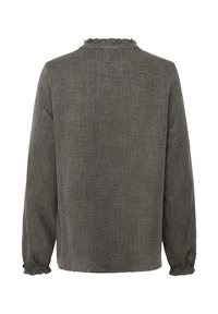Blouse marron texturée à manches longues avec un col froncé et des poignets élastiques, présentant un dos uni.