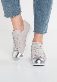 adidas superstar white and metallic