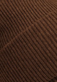 Brown knit fabric featuring vertical ribbed texture, soft and flexible, with a consistent pattern and rich, deep color.