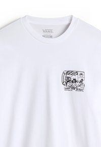 Biała bawełniana koszulka z grafiką przedstawiającą bajkowego vana. Metka informuje "VANS CLASSIC FIT MEDIUM". Krótkie rękawy, okrągły dekolt.