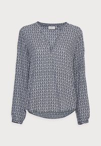 Maglietta a maniche lunghe bianca e blu navy con un motivo geometrico a foglia. Tessuto morbido, scollatura a v e orlo leggermente curvato. Maniche con polsini.
