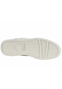 White rubber shoe sole with herringbone pattern. Stamped logo at center. Textured surface and smooth edges for grip and durability.