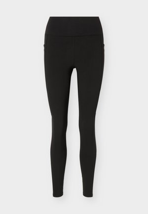 Mustad kõrge vöökohaga täispikad retuusid, kitsaste säärtega ja siledast kangast, esitatud valgel taustal lamedalt.