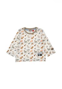 Langärmliges Kinderhemd in hellem Creme mit einem wiederholten Tier- und Traktormuster in Orange, Braun, Grau und Schwarz. Hat eine weiche Textur.