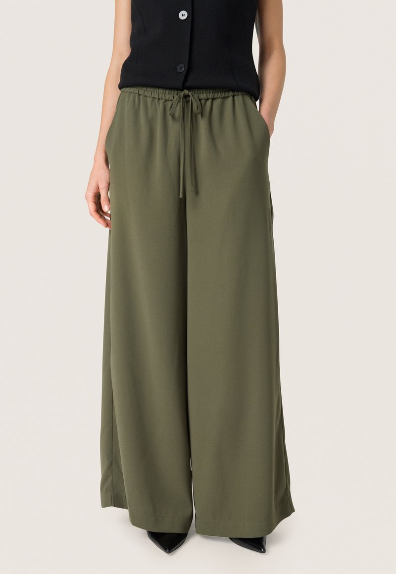 Olive green wide-leg trousers made of a soft fabric, featuring an elastic waistband with a drawstring and side pockets.