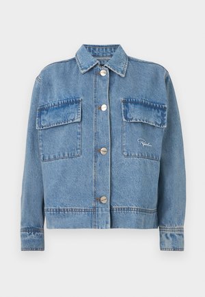 Denim jacket in light blue with a classic collar, two front pockets, silver buttons, and orange stitching accents. Features a boxy fit.