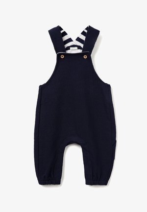 Navyblauwe overall van textuurstof, verstelbare gestreepte banden, houten knopen en zijzakken. Afgeronde beenopeningen met elastische cuffs.