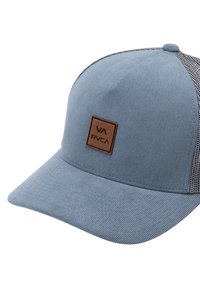 Blue corduroy cap with a brown leather patch, mesh side panels, and a curved brim. Textured fabric with a prominent logo detail.