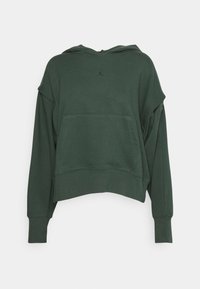 Sweat à capuche vert foncé avec manches longues et poche avant, présentant une coupe oversize et décontractée sur un fond uni.