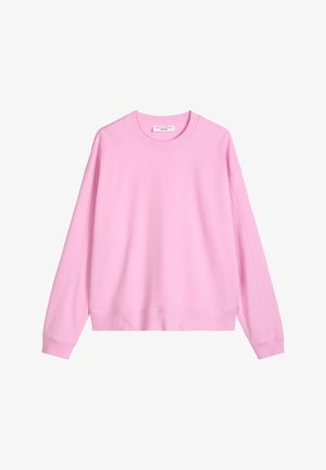 Jasnoróżowa bluza z okrągłym dekoltem, długimi rękawami oraz ściągaczami przy mankietach i u dołu, ułożona płasko na białym tle.