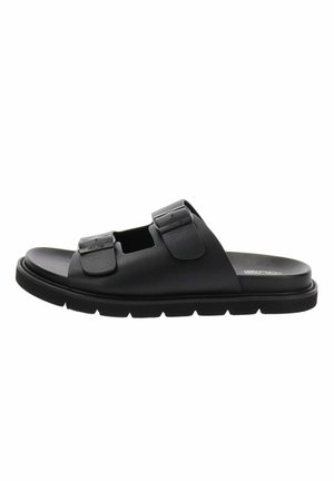 Sandale à glissière noire avec deux brides ajustables à boucle et une semelle striée, vue de côté.