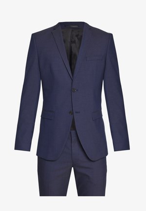 Marineblaues Sakko mit zwei Knöpfen, Reverskragen, einer Brusttasche und strukturiertem Stoff; darunter sind passende Hosen sichtbar.