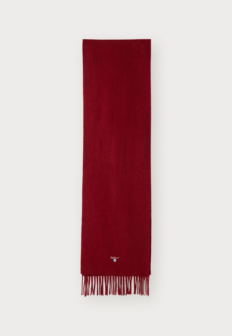 Écharpe en laine rouge au toucher doux, avec des bords à franges et un petit logo près du bas. Forme rectangulaire pour un port polyvalent.