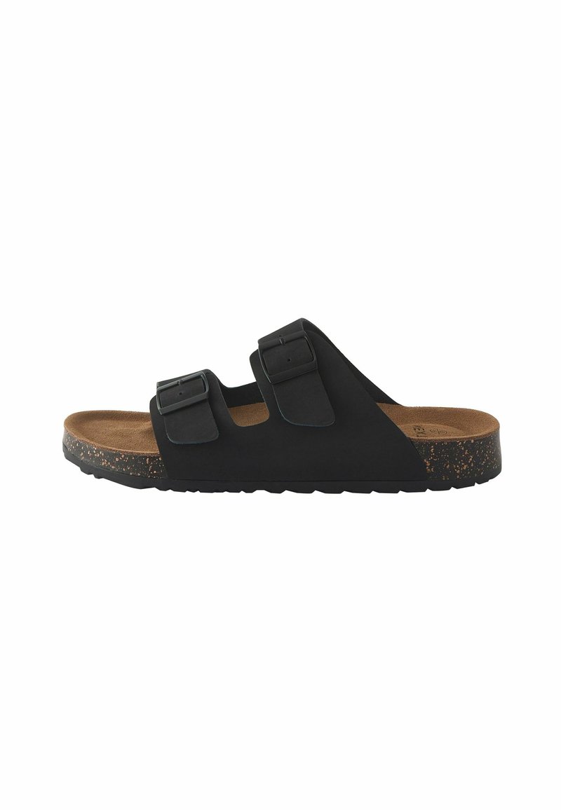 Sandali neri con due cinturini regolabili, soletta in sughero, suola in gomma texturizzata e un design leggero con una finitura semi-opaca.