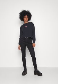 G-STAR SKINNY - Cargo trousers - black