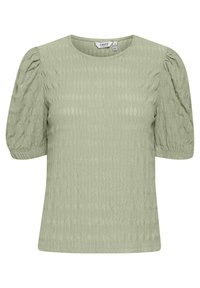 Top verde chiaro con texture, maniche corte a sbuffo, scollo rotondo e motivo a onde discreto. Realizzato in tessuto morbido per un indossare confortevole.