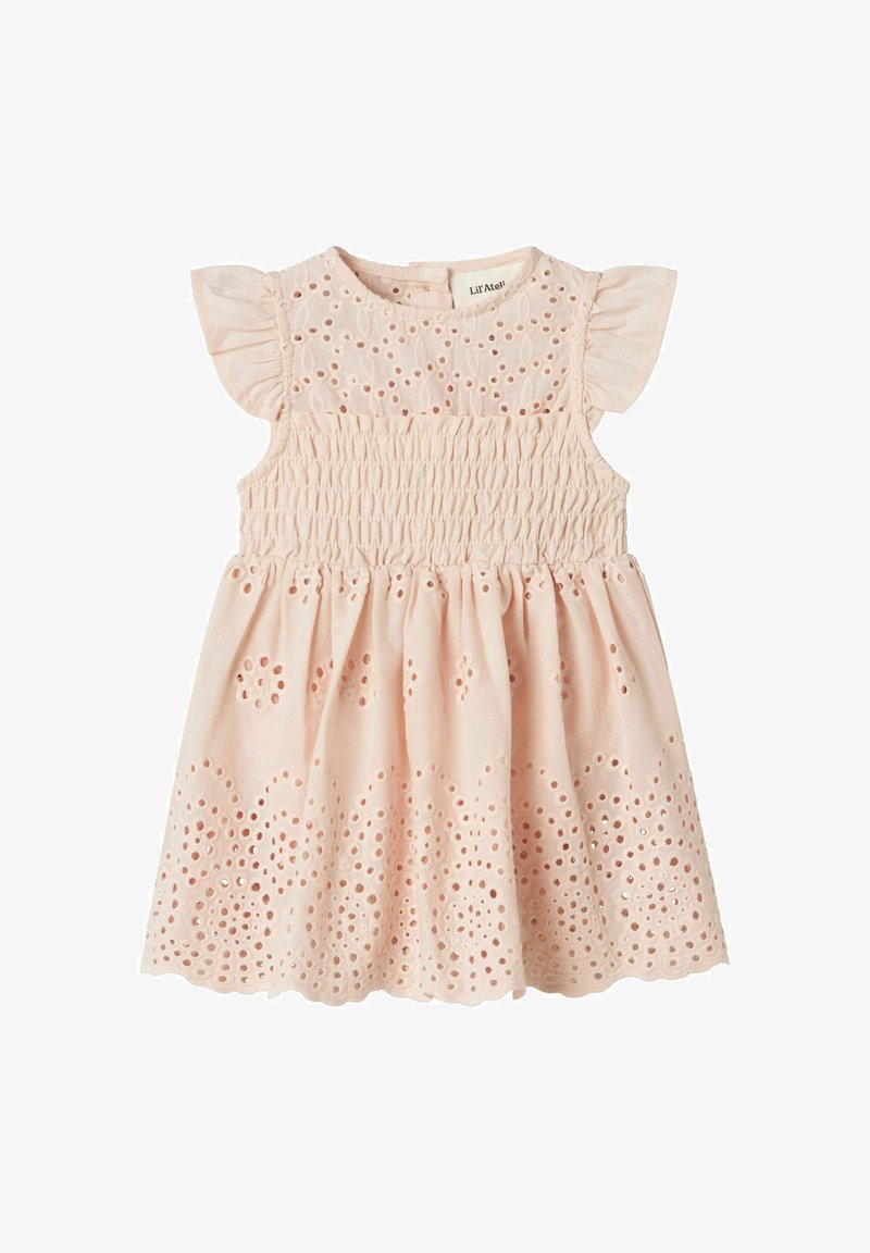 Šviesiai rožinė suknelė su raukšlėtu liemeniu, plačiomis rankovėmis ir siuvinėtais skylėmis sijono pakraštyje. Pagaminta iš medvilnės.