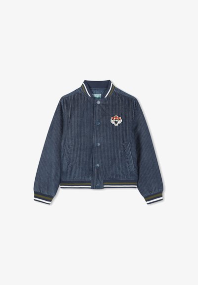 Veste bomber en velours côtelé bleu marine avec col, poignets et ourlet côtelés rayés en blanc et vert olive, présentant un petit visage de tigre brodé sur la poitrine.