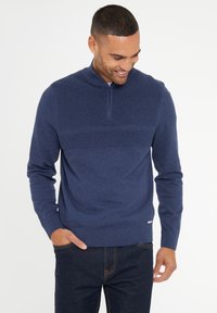 Navy-blaues Zip-Kragen-Sweatshirt mit strukturierten Horizontalstreifen im oberen Bereich. Aus weichem Material gefertigt, mit gerippten Bündchen und Saum.