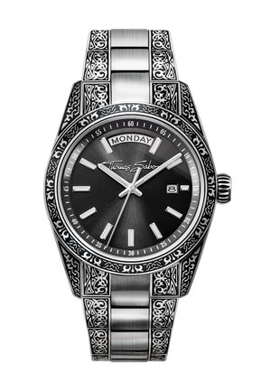 Silberne Armbanduhr mit schwarzem Zifferblatt, Tages- und Datumsanzeige, kunstvoll graviertem Band und Lünette sowie "Thomas Sabo"-Signatur auf dem Zifferblatt.
