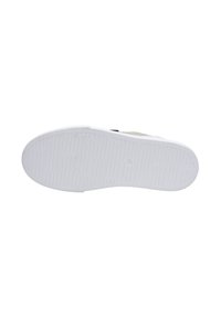 White sneaker outsole with a textured rubber surface, featuring visible treads and a slight curve at the heel area for comfort.