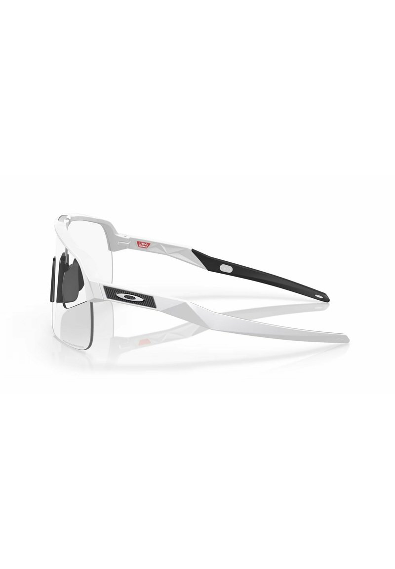 Sport sunglasses with a white and black plastic frame, large gray lenses, and rubber accents on the temples, lightweight design.