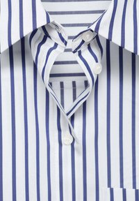 Button-up shirt with blue and white vertical stripes. Cotton fabric, classic collar, two white buttons visible, and a small chest pocket.