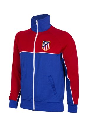 Rood-blauwe sportjas met ritssluiting, witte bies en het embleem van voetbalclub Atlético Madrid op de borst.
