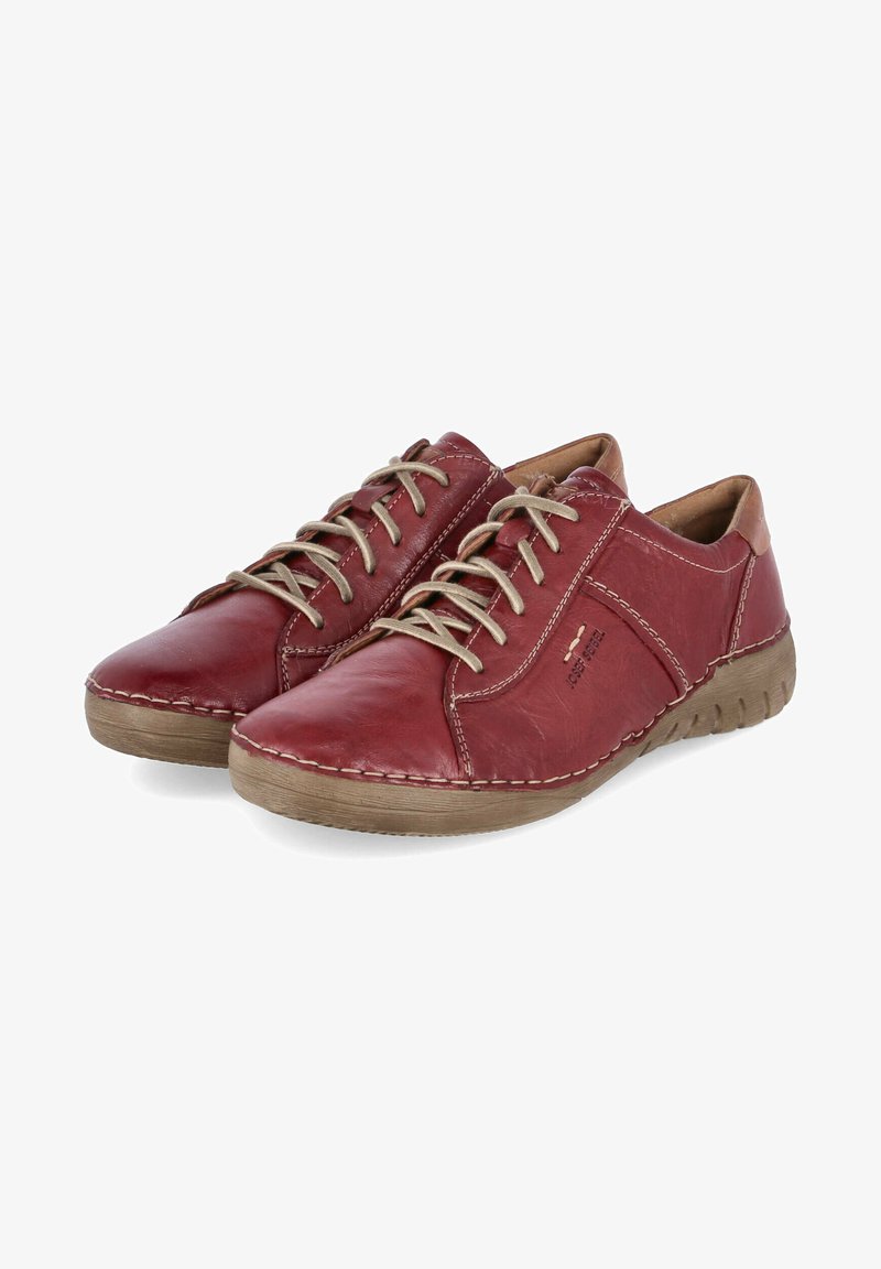 Red leather shoes featuring a rounded toe, beige laces, and contrasting tan leather accents. Textured rubber sole with stitching detail.