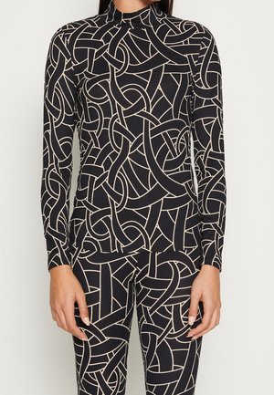 Langdurige top in marineblauw met een ribbelstructuur, met een abstract crème patroon van verwoven lijnen en een hoge halslijn.