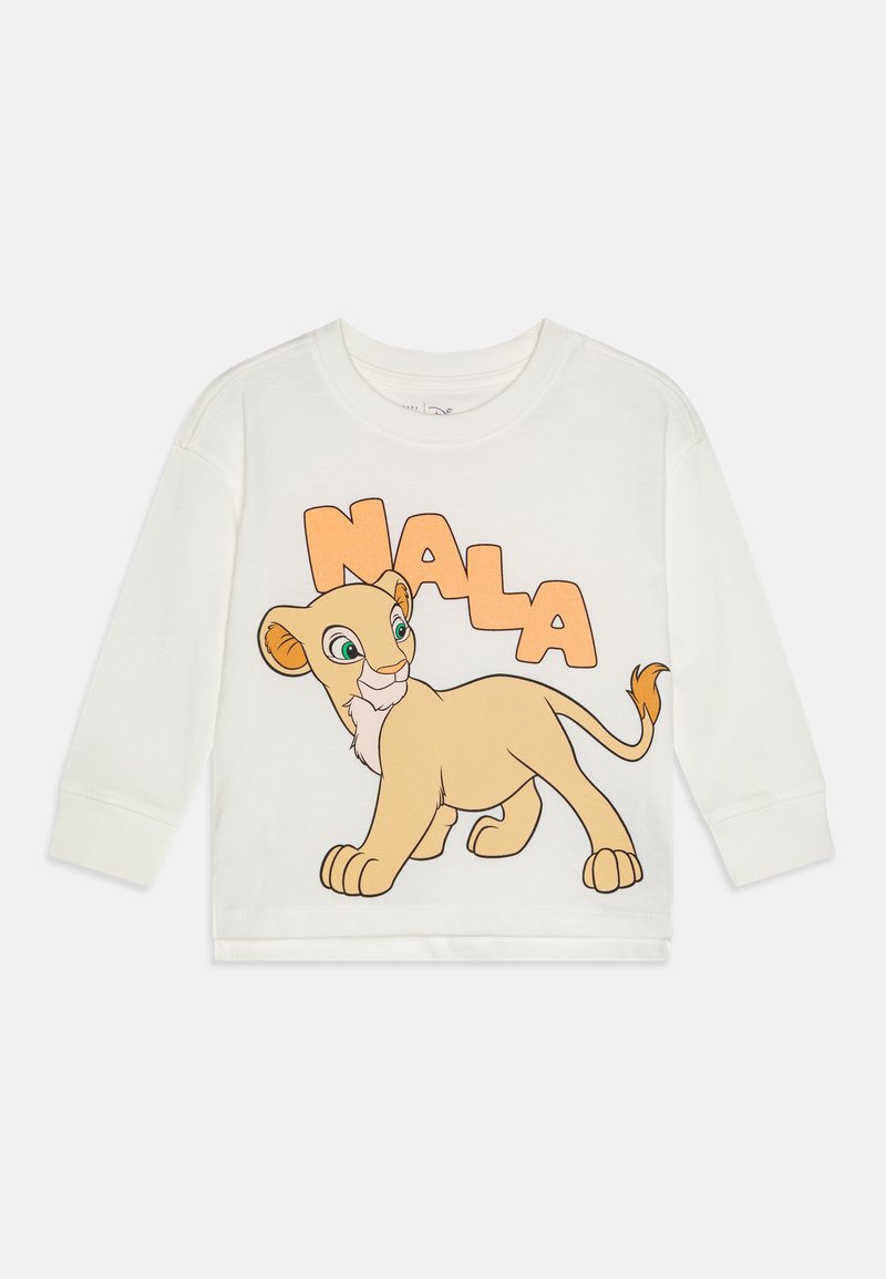 Biely dlhý rukáv bavlnené tričko s dizajnom karikatúrnej levice so zelenými očami a menom "NALA" v oranžovom texte.