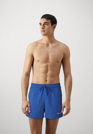 Shorts de baño azules con cintura elástica y cordón ajustable. Presenta un pequeño logo en el dobladillo. Tejido suave y ligero.