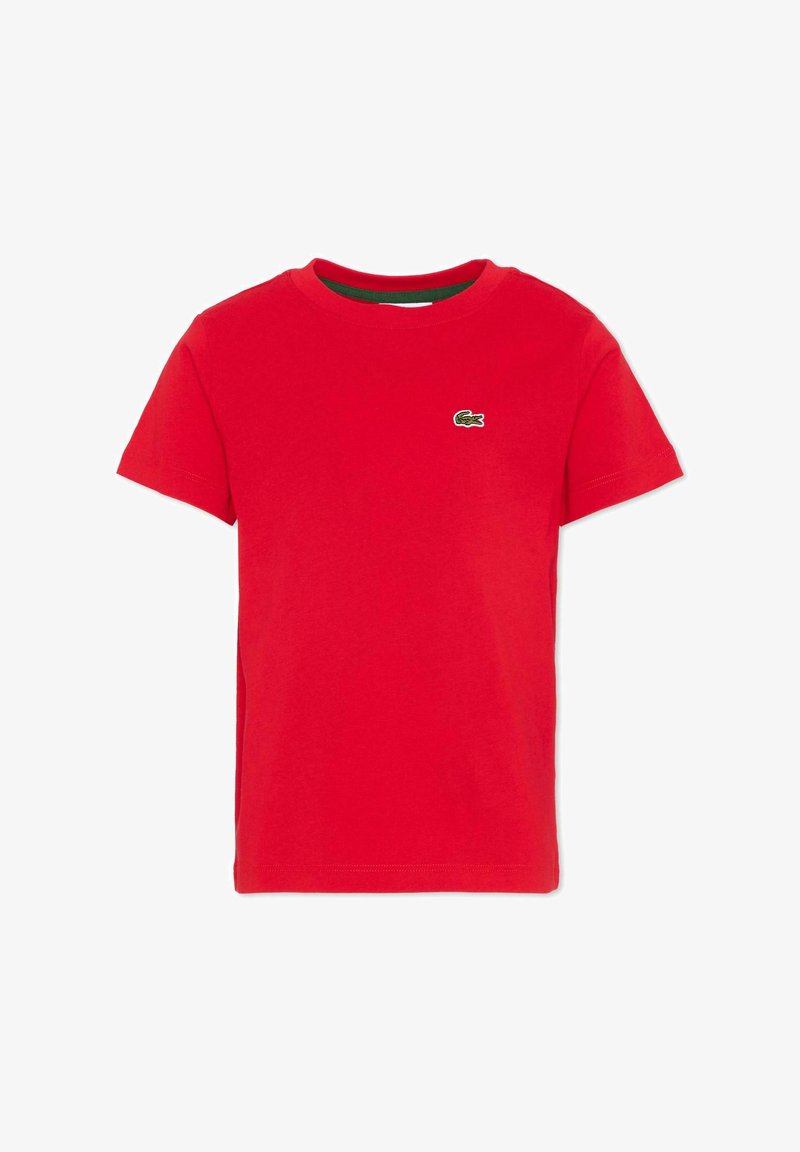 T-shirt rouge à manches courtes avec col rond et petit logo crocodile vert sur la poitrine gauche.
