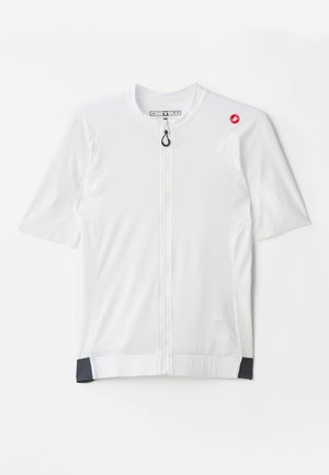 Maillot de cyclisme blanc à manches courtes avec fermeture éclair sur le devant, tissu texturé et accents noirs au niveau de l'ourlet. Logo sur l'épaule gauche.