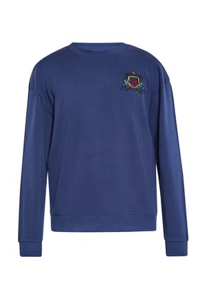 Marineblå sweatshirt med lange ærmer, rund halsudskæring og broderet våbenskjold på venstre bryst. Blødt stof med ribbede manchetter og kant.