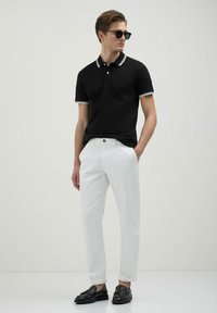 Calliope Polo - nero