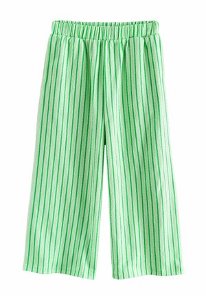 Nohavice s širokými nohavicami s vertikálnymi zelenými pruhmi a elastickým pásom, vyrobené z ľahkej textúrovanej tkaniny.